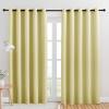imageNICETOWN Blackout Draperies Curtains for Kids Room Paler Yellow Set of 2 70 by 84 inches Window Treatment Thermal Insulated Solid Grommet Blackout Drape Panels for Bedroom